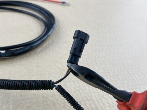 <p>Cut each wire (brown/black) <em></em>as close to the connector as possible.</p>