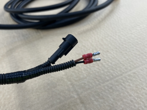 <p>Feed the corrugated sleeve back over the wires to ensure they stay protected.</p>