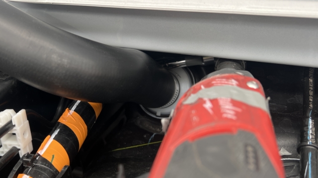 <p>Using an 8mm hose clamp, fix the FRC2 moulded fuel hose (PRT-007487) to the fuel tank.</p>