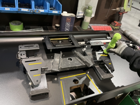 <p>Apply activator on the brackets and to the door nearest to the studs.</p>