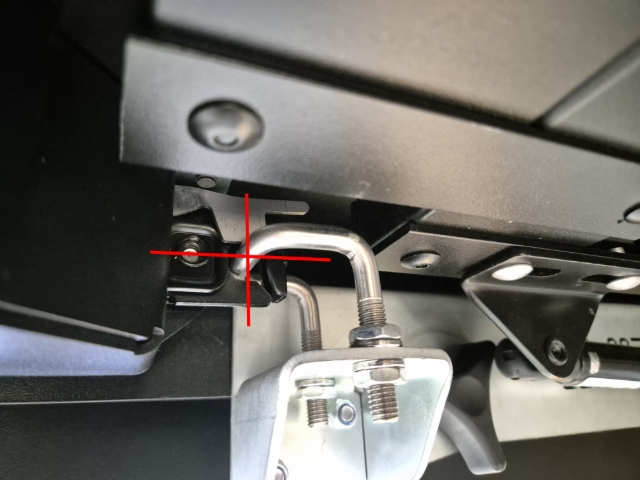 <p>Assessing the Load-Lid lock strike position and function. </p><p>The latch should align over the U-Bolt latch strike as shown.</p>