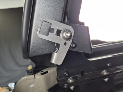 <p>Install a black M6x16 screw with a Nyloc Nut</p>