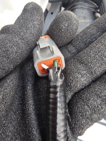 <p>Cover the wires with a loom cover.</p><p>Install a 4 pin Deutsch Plug.</p><p></p><ol><li><p>Green - Unlock</p></li><li><p>Brown - Lock</p></li><li><p>Red - Power feed</p></li><li><p>White - Earth</p></li></ol><p></p>