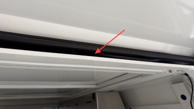 <p>Ensure the weather flap is behind the top sill of the service body.</p>