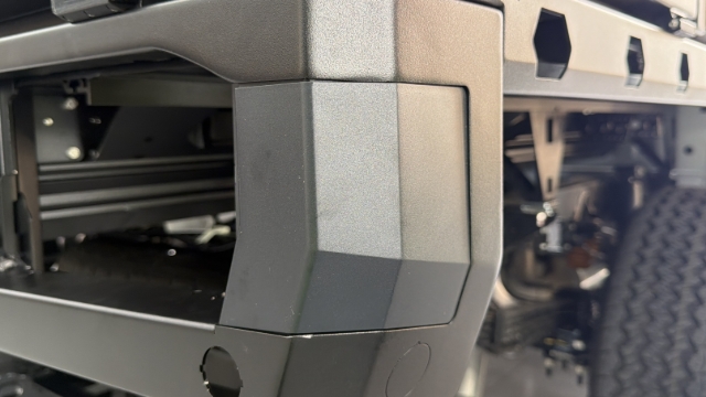 <p>Place a RH injection moulded housing inside the RH bumper.</p>