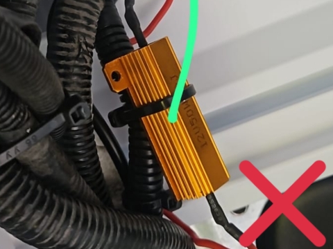 <p>All load resistors must be mounted securely to aluminum to dissipate heat unless pre-attached to taillight assemblies</p><p><em>Example shown is cable tied to the loom only </em></p>