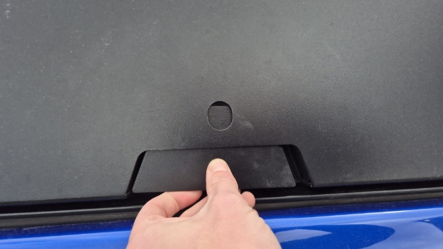 <p>Insert the backing plate into the lock housing while pressing the plate against the lock to prevent smudging the glue.</p>
