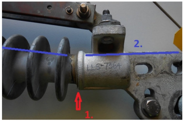 <p>Insulator position within the termination.</p><p>Is the RTV seal (1.) around the insulator complete and free from cracks (as per image</p><p>Does the alignment of the Insulator to the end fittings is required to be in a straight line (2.).</p>