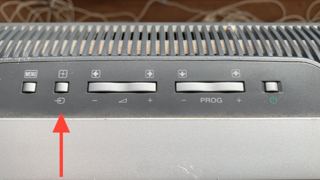 <p>The TV controls are on the top of the TV</p><p>Turn the TV on if needed then press the input button (red arrow) until your device shows up on the TV</p>