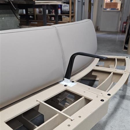 <p>Once all units are in place with arms - tables attached, place all backrests onto carcasses </p>