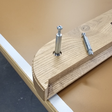 <p>Insert cam bolts to either end of both side rails</p>