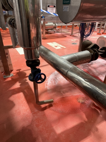 <p>Condensate drains are typically installed on the lowest point in the steam system. The picture is of a thermal trap, it can be manually opened. In the closed position it will remove condensate it will close due to thermal expansion of the metal.</p><p></p><p>The design of the steam system is such that the condensate is removed well before water hammer conditions can occur.</p><p></p><blockquote><p>Additional risk is present when introducing steam into cooled pipe work as the steam is rapidly loosing energy to warm the system, this can temporarily overwhelm the condensation drains and induce water hammer conditions.</p></blockquote><p></p>