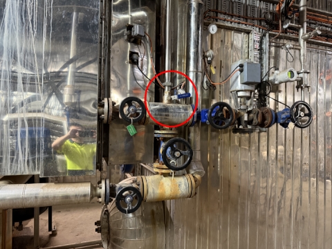 <p>Kickback line is the small pipe on top. In this photo it’s in the correct position. </p>
