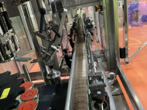 <h5>Filler Outfeed</h5><p>Adjust filler outfeed rails to the out position for 750ml. Move in to suit other bottles.</p><blockquote><p>Check spacing with a bottle</p></blockquote><p></p>