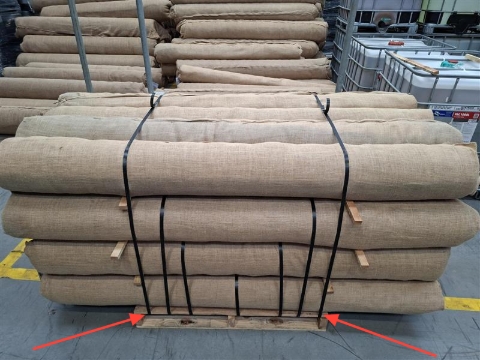 <p>On your final layer, add two straps as far to the end as you can inside the pallet.</p><p>For long rolls you can also add a final strap to each end, further binding the rolls together.</p>