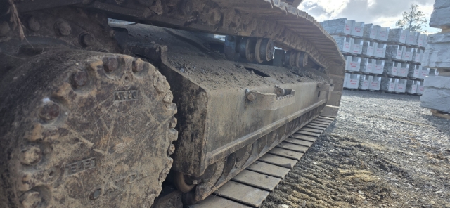 <p><strong>Inspect the tracks and undercarriage</strong></p><p>Walk around both sides of the excavator.</p><p>Inspect:</p><ul><li><p>Track chains</p></li><li><p>Track shoes</p></li><li><p>Shoe bolts</p></li><li><p>Rollers</p></li><li><p>Idlers</p></li><li><p>Sprockets</p></li><li><p>Final drives</p></li><li><p>Track guards</p></li><li><p>Track tension</p></li></ul><p>Remove accumulated mud, concrete or debris where it is safe to do so. Volvo notes that failing to clean an excavator’s undercarriage can reduce its service life.</p><p><strong>Pass:</strong> Undercarriage is secure, reasonably clean and track tension appears correct.<br><strong>Fail:</strong> Loose track shoes, missing bolts, damaged rollers, oil leakage or abnormal track tension is found.</p>