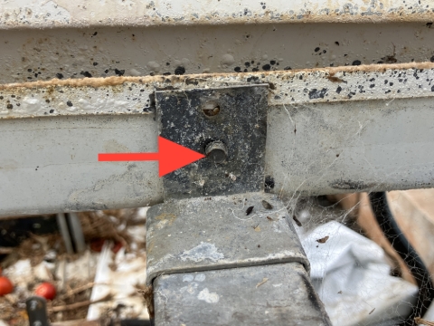 <p>Release the end of the bench by removing any bracket fixings that attach the bench to the rear support rail.&nbsp;</p>