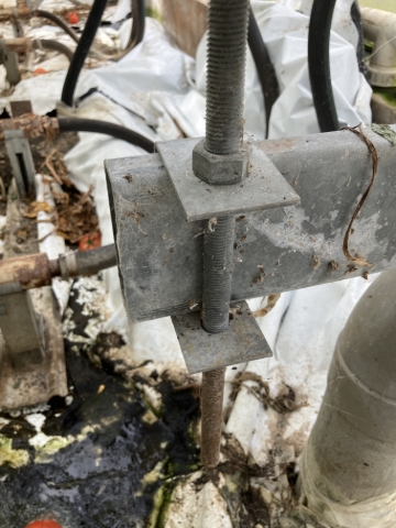 <p>Remove the “C” bracket and be ready for install against the newly positioned nut on the cut and measured threaded rod that is still connected to the rear gutter support rail.&nbsp;</p>
