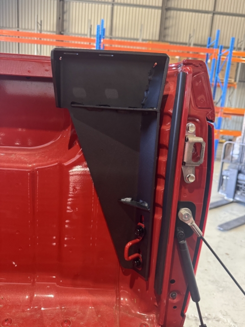 <p>Fit the rear brackets in place as shown using the M8x25mm bolts with captive spring and flat washers - Refit the tie down loop back in place too.</p><p>Leave the bolts finger tight to allow for adjustment when fitting the tub rack.</p>