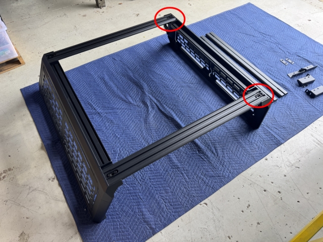 <p>Fit the opposite end of the crossbars to the opposite side frame.</p><p>You will need:</p><ul><li><p>4x Flat washers</p></li><li><p>4x Flanged Nuts</p></li><li><p>4x 35mm Socket Head Cap Bolts</p></li></ul><p></p>