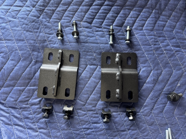 <p>Collect hardware required to fit the middle brackets.</p><p>You will need:</p><p></p><ul><li><p>6x M8x16mm Hex Head Bolts</p></li><li><p>6x M8 Flat washers</p></li><li><p>6x M8 Spring Washers</p></li><li><p>6x M8 Spring Nuts</p></li><li><p>4x M6x40mm Hex Head Bolts</p></li><li><p>4x M6 Flat washers</p></li><li><p>4x M6 Spring Washers</p></li><li><p>4x M6 Flange Nuts</p></li><li><p>L and R - Middle Brackets</p></li></ul><p></p>