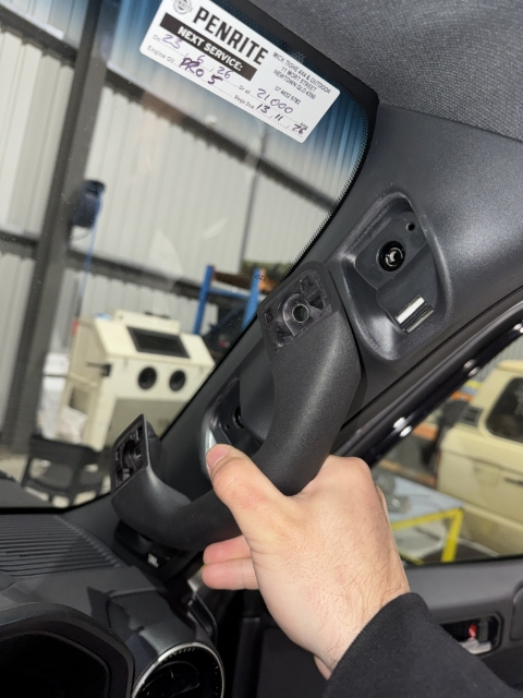 <p>Remove the grab handle once the bolts have been fully removed.</p>