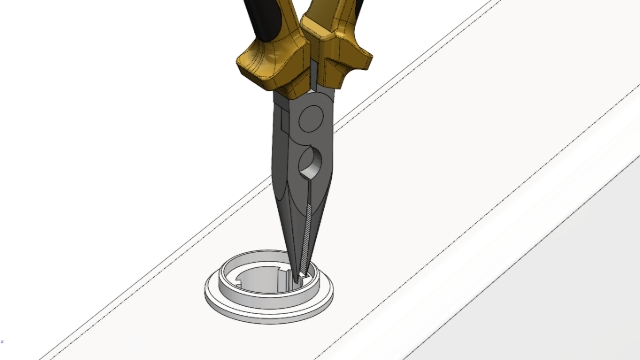 <h1>STEP 2</h1><p></p><p>Using long nose pliers, grip the small tang on the edge of the inner peice.</p><p></p><p>Bend the tang inwards slightly and pull up with the pliers</p><p></p><p></p><blockquote><p>Note the tang has a "hook" on the side that locates in a slot in the main body, that is why you need to bend inwards slightly&nbsp; - to release the hook.</p></blockquote><p></p>