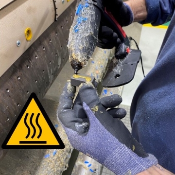 <p>Hold rubber near hot end. Apply appropriate amount of glue for size of rubber. </p><p>Beware of the nozzle and glue it is extremely hot!!</p>
