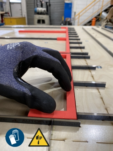 <p>Carefully press glued rubber down onto the correct position on the Die. </p><p>The blades are very sharp take care not to cut yourself.</p>