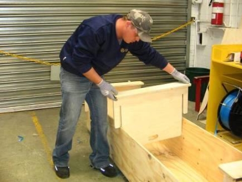<p>Turn the coffin box over and remove the supports.</p>