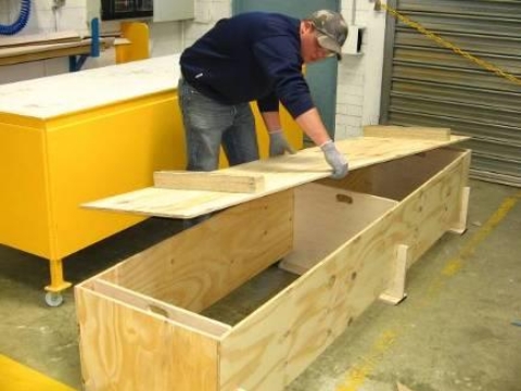 <p>Place the bottom of the box with the legs facing outward onto the main coffin box.</p>