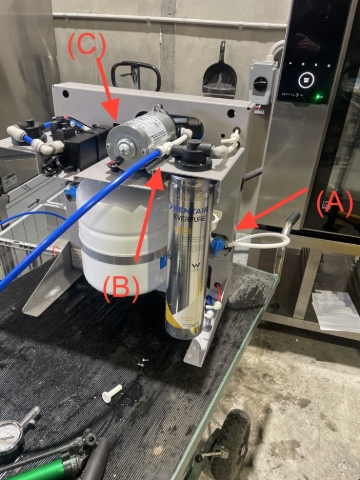 <ol><li>Place unit on work bench and remove top blue cover. There are two screws either side of the blue cover. </li><li>Connect white water inlet tube into the right hand side JG 3/8 shut off valve ( A). With valve in the off position turn on water.</li><li>Remove 3/8" white JG plug from Tee piece on the top right hand side of unit (B).</li><li>Ensure tank is turned off using the the JG tank valve (C)</li><li>Connect blue tube into the Tee piece and place into suitable container for flushing.</li><li>Install the 4FC5-S cartridge into the first head assembly on right hand side.</li><li>Do not connect to power at this stage.</li></ol>