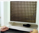 <h3><strong>6 Remove water trough.</strong></h3><p></p><p>Depress tabs on right and left side of the water trough. Allow front of water trough to drop as you pull forward to disengage the rear pins.</p>