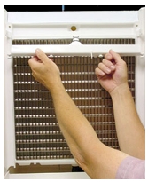 <p><strong>8. Remove the water distribution tube.</strong></p><p>Loosen the two outer screws (do not remove screws completely; they are retained to prevent loss). Pull forward on the distribution tube to release from slip joint. Remove the water distribution tube. Disassemble the distribution tube by loosening the two (2)middle thumbscrews and dividing the distribution tube into two pieces. Remove both water distribution tubes on 48” models</p>
