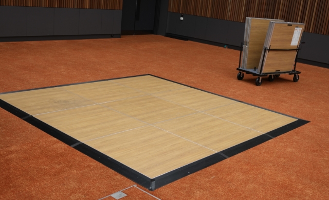 <h1><strong>Position Dance Floor Stillage(s)</strong></h1><p></p><p>Roll the stillage into place next to the work space.</p>