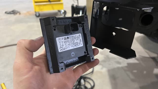 <p>Set the 3-D printed retaining clips</p>