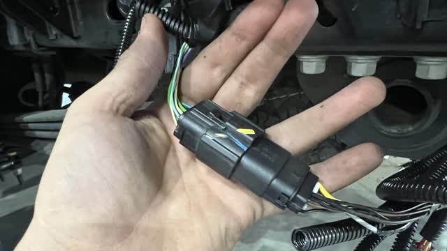 <p>Go to the passenger side and identify the plug. On the left side showns the vehicle plug, the right side is the Tray/Canopy side.
Strip back the plastic sheaths to expose the wires as shown</p>