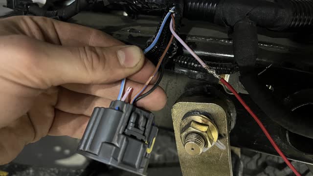 <p>If the plug has 4 wires, it will look like this . We use the pinky/grey wire. (This vehicle was a WildTrak)</p>
<p>Connect it to the red wire on supplied harness. It will look like this.</p>