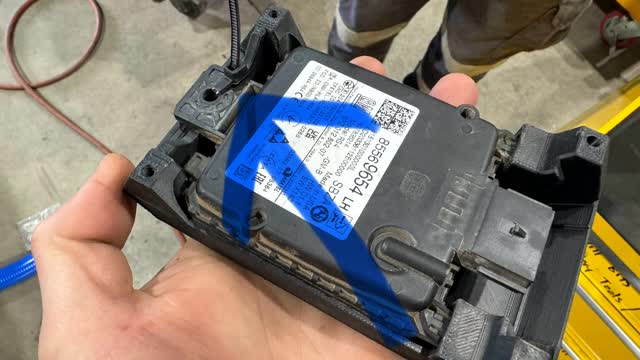<p>Fit the radars to the supplied plastic brackets.
Notice that a zip tie has been used to hold it in</p>