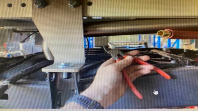 <p>Cut zip ties which hold the stainless pipe up during transport.</p>
<p>Cut them, then the stainless pipe will drop down near the tank</p>