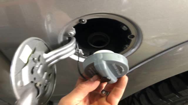 <p>Open fuel door, and remove cap</p>