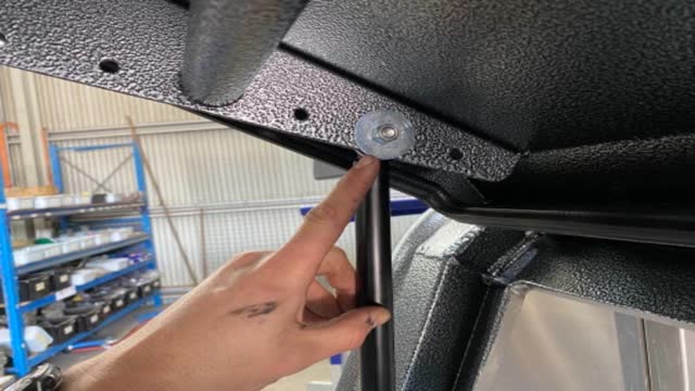 <p>Side doors, 2nd hole from hinge</p>

