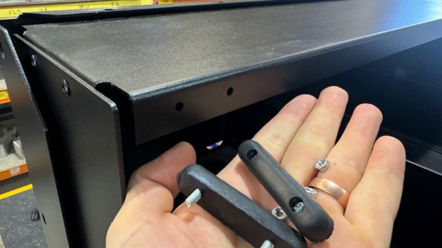 <p>Fit the rubber bumpers</p>
