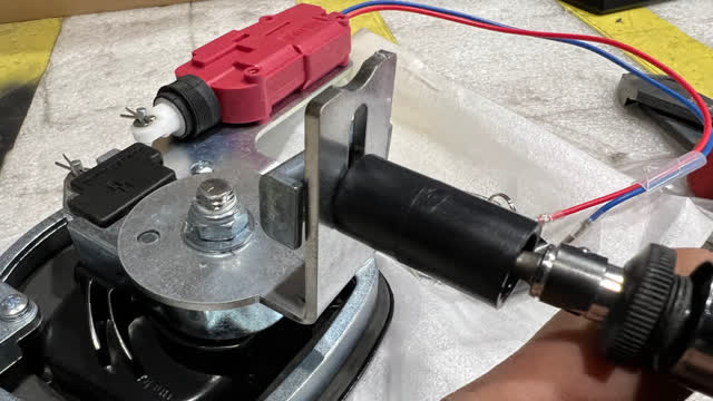<p>Fit long black striker to latch.</p>
<p>The exact position will be adjusted later to get the correct firmness</p>