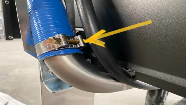<p>Clamped  on the straight section of pipe</p>
