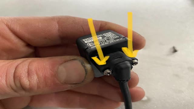 <p>Re-fit the camera plug and tighten. Re-use the original screws</p>
