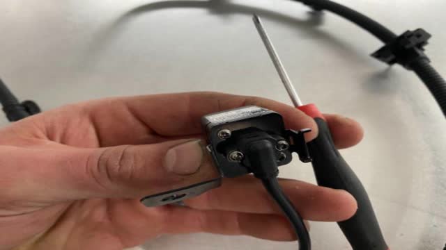 <p>Use a fine Phillips Head screwdriver to remove 4 x screws</p>
