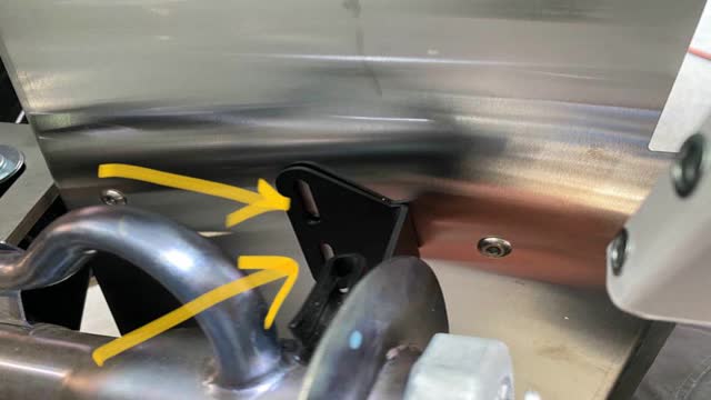 <p>Use a pen to mark where the bracket meets the mud guard</p>
