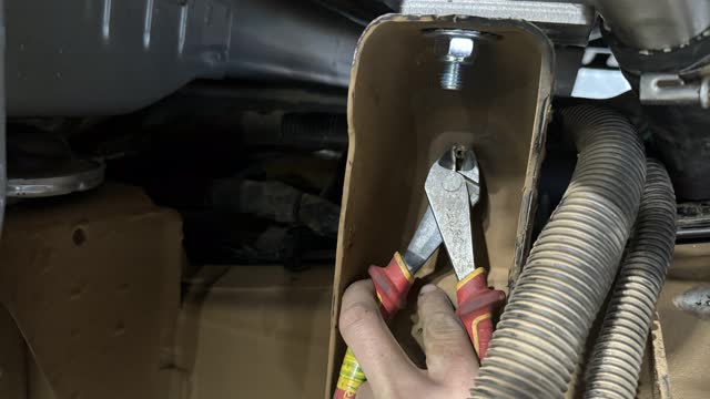<p>Trim this plastic plug it is holding the ad blue hoses</p>