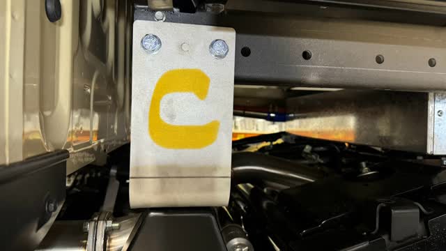 <p><strong>Front Mount</strong>. In the front Tray chassis holes. Laser etched with “C”</p>
